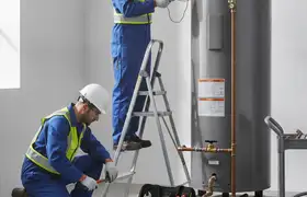 Fort Worth, TX plumber repairing a water heater for fast emergency plumbing service